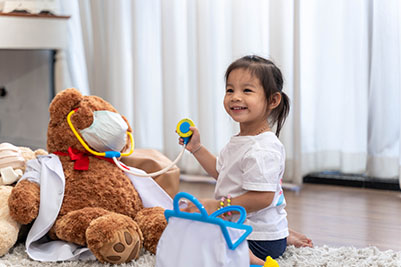 Little girl and teddy bear